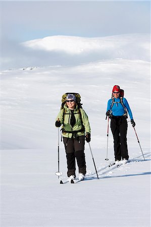 simsearch:6102-07158155,k - Two women doing cross country skiing, Ammarnas, Lapland, Sweden Stock Photo - Premium Royalty-Free, Code: 6102-07455805