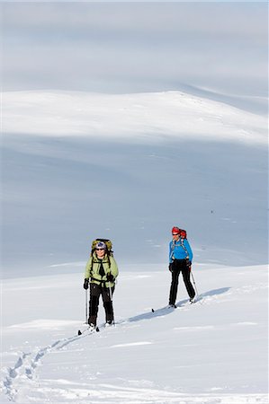 simsearch:6102-07158155,k - Two women doing cross country skiing, Ammarnas, Lapland, Sweden Stock Photo - Premium Royalty-Free, Code: 6102-07455806