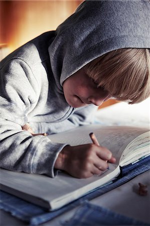 sweden blond boy - A boy with his homework Stock Photo - Premium Royalty-Free, Code: 6102-07602559
