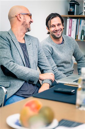 Two men working in office, Gothenburg, Sweden Stock Photo - Premium Royalty-Free, Code: 6102-07602518