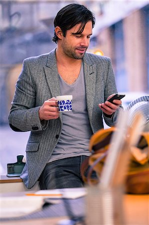 Man in office having coffee break, Gothenburg, Sweden Foto de stock - Sin royalties Premium, Código: 6102-07602524