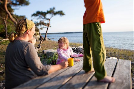 simsearch:6102-08542382,k - Mother with two children resting on beach, Gotland, Sweden Stock Photo - Premium Royalty-Free, Code: 6102-07768326