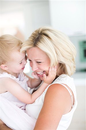 Pregnant woman playing with daughter, Stockholm, Sweden Stock Photo - Premium Royalty-Free, Code: 6102-07768667