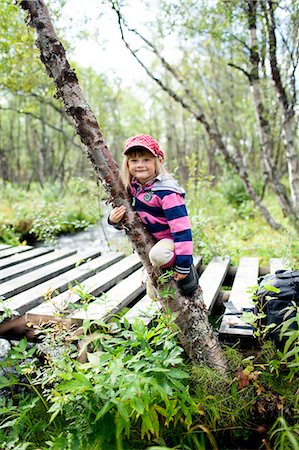 simsearch:6102-07844212,k - Girl near wooden bridge in forest, Norrbotten, Lapland, Sweden Stock Photo - Premium Royalty-Free, Code: 6102-07768683