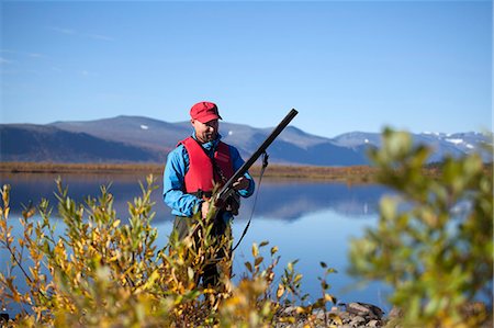 simsearch:6102-06337050,k - Man hunting, Nikkaluokta, Norrbotten, Lapland, Sweden Stock Photo - Premium Royalty-Free, Code: 6102-07768680