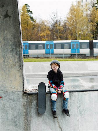 front of streetcar - Boy with skateboard, Stockholm, Sweden Stock Photo - Premium Royalty-Free, Code: 6102-07768871