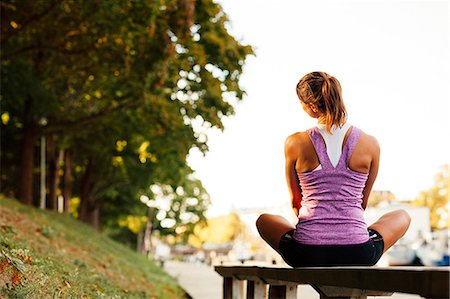 park exercise - Young woman stretching, Uppsala, Sweden Stock Photo - Premium Royalty-Free, Code: 6102-07768816