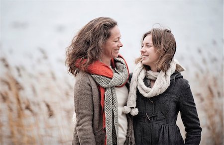 Mother and teenage daughter at water Stock Photo - Premium Royalty-Free, Code: 6102-07769397