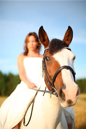 Woman ridding on horse Stock Photo - Premium Royalty-Free, Code: 6102-07769413