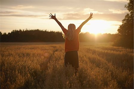 feel - Boy standing on field at dusk Stock Photo - Premium Royalty-Free, Code: 6102-07790018