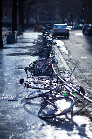 Bicycles parked along street Stock Photo - Premium Royalty-Free, Code: 6102-07790143