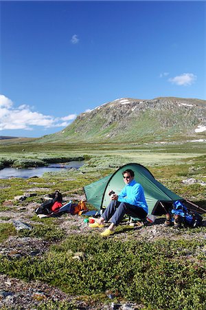 simsearch:6102-07844212,k - Woman in front of tent Stock Photo - Premium Royalty-Free, Code: 6102-07790103