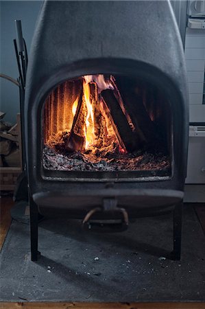 Fire in fireplace Stock Photo - Premium Royalty-Free, Code: 6102-07790139