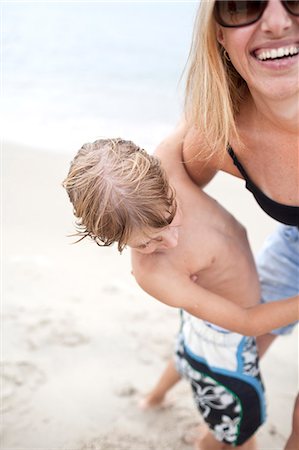 Happy woman with son on beach Stock Photo - Premium Royalty-Free, Code: 6102-07843308
