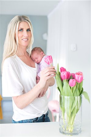 scandinavia - Woman holding newborn daughter Stock Photo - Premium Royalty-Free, Code: 6102-07843446