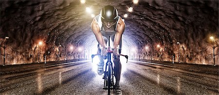 Man cycling through tunnel Stock Photo - Premium Royalty-Free, Code: 6102-07843616