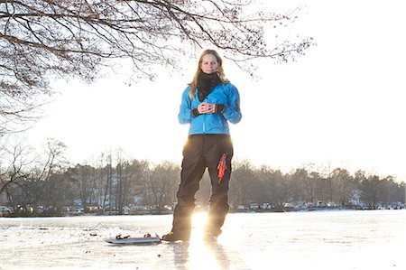 simsearch:6102-08520961,k - Woman ice-skater looking at camera Stock Photo - Premium Royalty-Free, Code: 6102-07843630