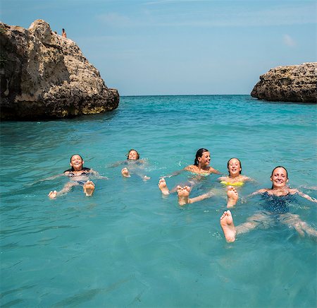 Teenage girl swimming in sea Stock Photo - Premium Royalty-Free, Code: 6102-07843959