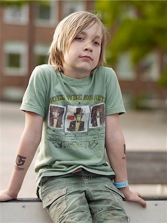 sweden blond boy - Boy sitting and looking at camera Stock Photo - Premium Royalty-Free, Code: 6102-07844230