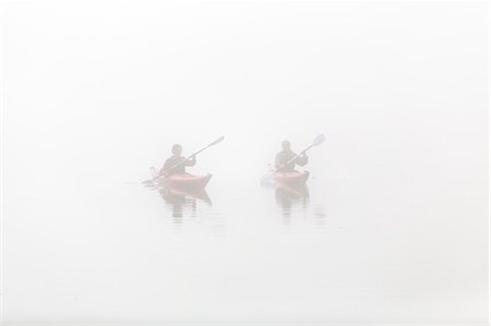 People kayaking in fog Stock Photo - Premium Royalty-Free, Code: 6102-08062944