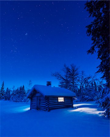 Illuminated log house at night Stock Photo - Premium Royalty-Free, Code: 6102-08062997