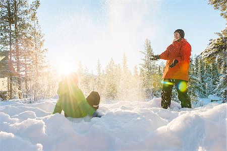 Mother with son playing at winter Stock Photo - Premium Royalty-Free, Code: 6102-08063114