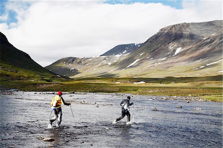 simsearch:6102-07844212,k - Hikers crossing mountain river Stock Photo - Premium Royalty-Free, Code: 6102-08000500