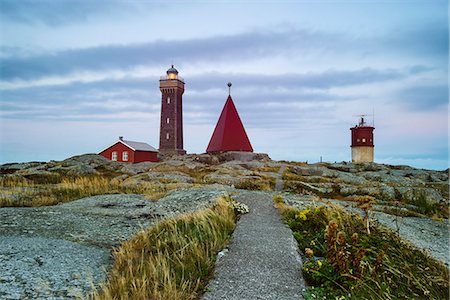Lighthouse on rocky coast Stock Photo - Premium Royalty-Free, Code: 6102-08000608