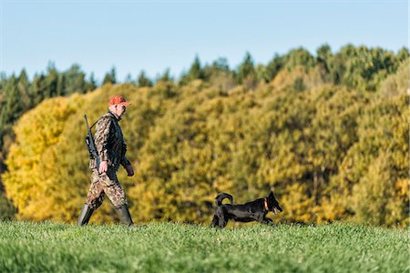 simsearch:6102-06337050,k - Man hunting with dog Stock Photo - Premium Royalty-Free, Code: 6102-08000771