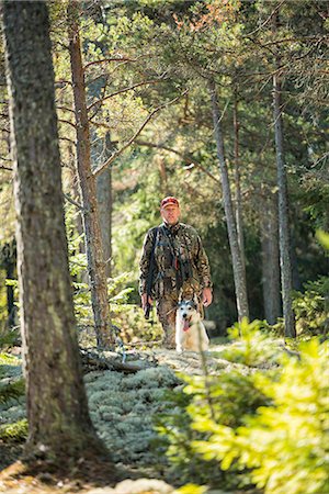 simsearch:6102-06337050,k - Man hunting with dog Stock Photo - Premium Royalty-Free, Code: 6102-08000777