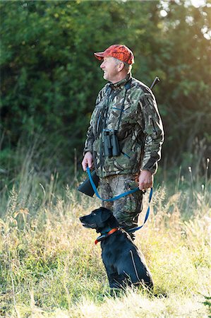 simsearch:6102-06337050,k - Man hunting with dog Stock Photo - Premium Royalty-Free, Code: 6102-08000776