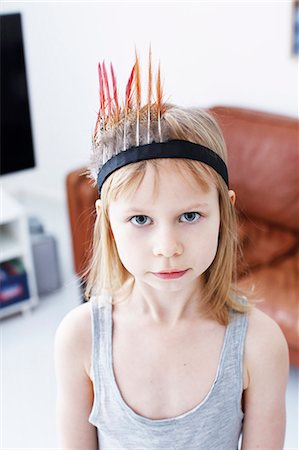 feather headdress - Portrait of girl in feather headdress Stock Photo - Premium Royalty-Free, Code: 6102-08001128