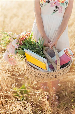 Woman holding picnic basket Stock Photo - Premium Royalty-Free, Code: 6102-08168823