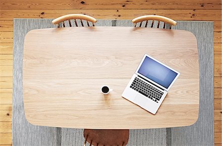 Laptop and coffee on wooden desk Stock Photo - Premium Royalty-Free, Code: 6102-08168827