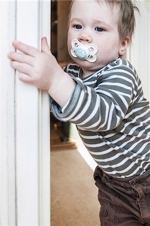 shy baby - Boy with pacifier Stock Photo - Premium Royalty-Free, Code: 6102-08120214