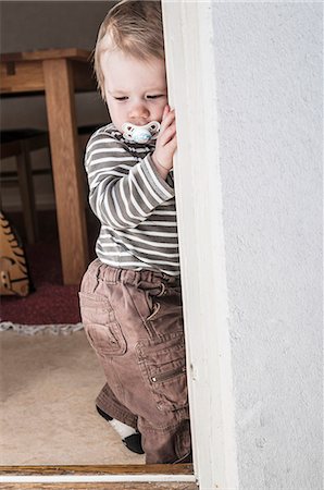 shy baby - Boy with pacifier Stock Photo - Premium Royalty-Free, Code: 6102-08120215