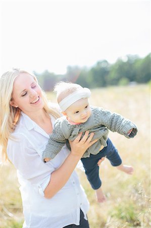 Mother with baby girl on meadow Stock Photo - Premium Royalty-Free, Code: 6102-08120400