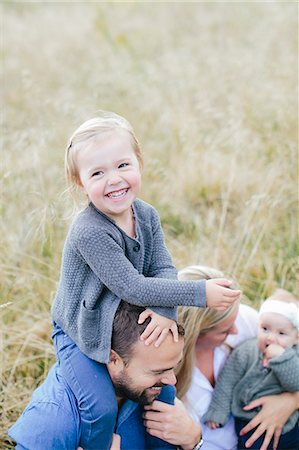 simsearch:6102-08542382,k - Parents with children on meadow Stock Photo - Premium Royalty-Free, Code: 6102-08120404