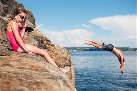 female kid bath - Man jumping into sea Stock Photo - Premium Royalty-Free, Code: 6102-08120541