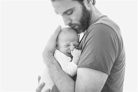 families black and white photo - Mid adult man with newborn baby Stock Photo - Premium Royalty-Free, Code: 6102-08120642