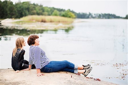 preteen girls looking older - Mother with daughter relaxing at lake Stock Photo - Premium Royalty-Free, Code: 6102-08121013