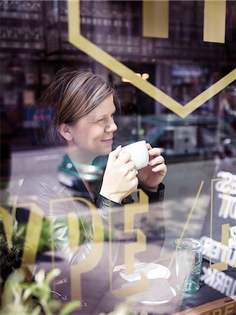 simsearch:649-07436838,k - Woman having coffee in cafe Stock Photo - Premium Royalty-Free, Code: 6102-08270716