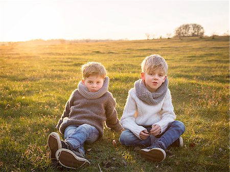 sweden blond boy - Boys sitting together on meadow Stock Photo - Premium Royalty-Free, Code: 6102-08270736