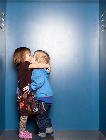 Boy and girl kissing Stock Photo - Premium Royalty-Free, Code: 6102-08271035