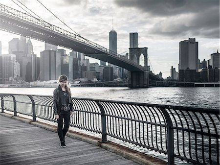 person thinking sad adult - Woman walking, skyscrapers on background Stock Photo - Premium Royalty-Free, Code: 6102-08271190