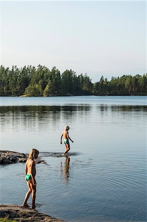 Boys and girls at water Stock Photo - Premium Royalty-Free, Code: 6102-08271447