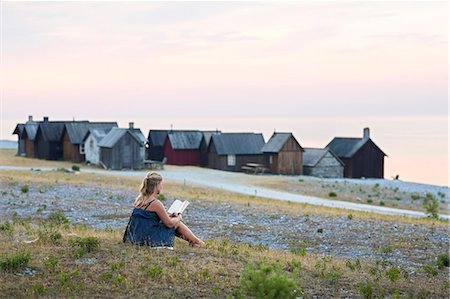 Woman reading book Stock Photo - Premium Royalty-Free, Code: 6102-08278893