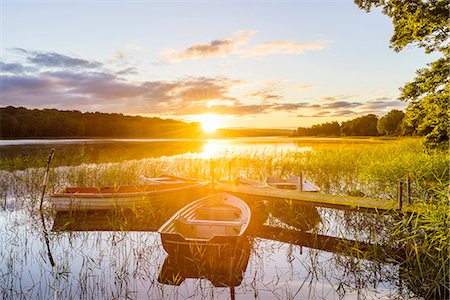 Rowboats at sunset Stock Photo - Premium Royalty-Free, Code: 6102-08388028