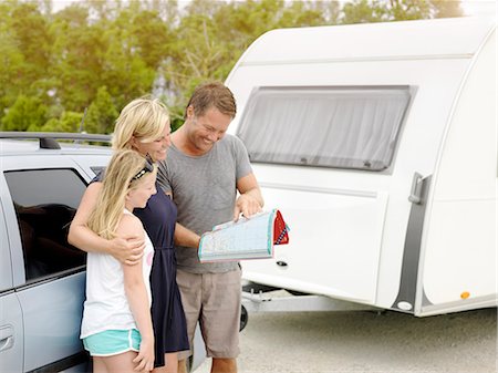 Family reading map Stock Photo - Premium Royalty-Free, Code: 6102-08329684