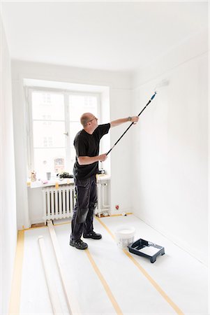 simsearch:6102-07158067,k - Man painting room Stock Photo - Premium Royalty-Free, Code: 6102-08329949